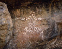 Aboriginal rock painting onto red and black rock face