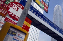 Cropped view of road signs and bus stop.