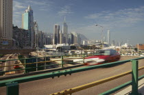 Elevated highway with Causeway Bay and city skyline behind.former crown colony reverted to Chinese rule in 1997