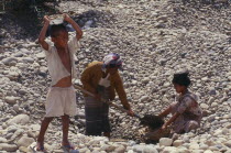 People gathering stones for road building on the upper Ayeyarwady River Burma