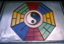 Yin Yang symbol above shop house on Loi Kroa Road