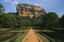 View along path toward huge monolithic rock site of fifth century citadel. Also called Lion Rock.