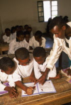 Teacher and pupils in classroom at Gacmodhere Primary School.