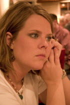 Woman aged 29 quietly waiting for food at the Red Lobster restaurant.