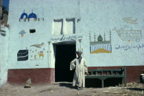 Muslim man who has painted his pilgrimage to the Haj on his home