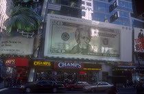 Advertising showing new US Dollar note with added colour for increased security