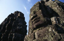 The Bayon.  Detail of huge face thought to be that of Jayavarman VII on one of the four faced towersAsian Cambodian Kampuchea Religion Southeast Asia 1 4 History Kamphuchea Religious Single unitary O...