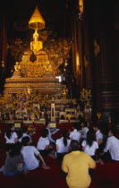 Wat Pho main prayer hall with a group of Thai students and teacher seated in front of Golden seated BuddhaAsian Kids Learning Lessons Prathet Thai Raja Anachakra Thai Religion Siam Southeast Asia Tea...