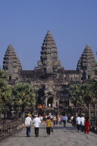 The causeway leading to the central complex with  tourist crowds at Chinese New YearAsian Cambodian Kampuchea Religion Southeast Asia History Holidaymakers Kamphuchea Religious Sightseeing Tourism To...