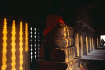 Buddha statue in gallery on the third level at sunsetAsian Cambodian Kampuchea Religion Southeast Asia History Kamphuchea Religious