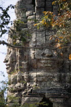 Ta Prohm monastic complex detail of the four faced west gate seen through treesAsian Cambodian Kampuchea Religion Southeast Asia 4 History Kamphuchea Religious