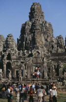 Bayon Temple south entrance with tourists during Chinese New YearAsian Cambodian Kampuchea Religion Southeast Asia History Holidaymakers Kamphuchea Religious Tourism