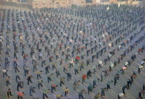 Looking over mass exercise class from elevated viewpoint. Peking