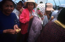 Crowd of passengers on board a ferry  close cropped view.