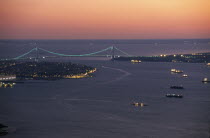 Aerial view of the sea approaches to the city and the Verrazano Narrows Bridge at night.Designed in 1964 by Othmar H. Ammann.