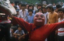 Ton San Village.  Dancer wearing carnival head at Tet dance celebrating the Vietnamese New Year.