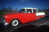 Old red and white coloured 1950 s US car