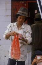 Money changer at the Neak Long ferry.