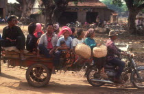 The market motorbike taxi and passengers.