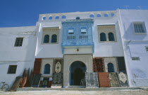 Rug shop facade with display of rugs outside