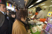 Narita San Temple. New Years Holiday worshippers buying Buddhist charmsNarita