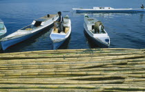 Men on boats docking in port with Bamboo at dockside.