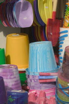 Buckets and spades for sale at a beach side shop.