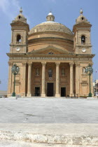 Church facade with corner towers and domed roof