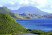 View over green hilly coastline and blue sea