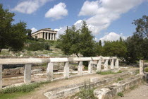 Ancient Agora ruins with the Temple of Hephaestus in the distance