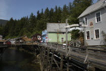 View along Creek Street waterside houses and wooden walkway on propped up over the waters edge