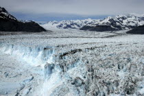 Columbia Glacier ice cliffs and distant mountain peaks