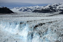 Columbia Glacier ice cliffs and distant mountain peaks