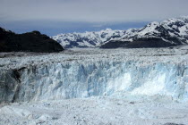 Columbia Glacier ice cliffs and distant mountain peaks