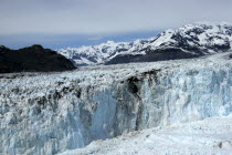 Columbia Glacier ice cliffs and distant mountain peaks