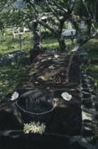 Marquesas.  Hiva Oa.  Grave of the painter Paul Gaugin.