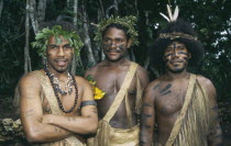 Port Vila.  Three men wearing traditional dress and body decoration.