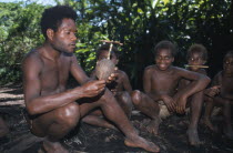 Tanna.  Kastom traditional village tribesman and children.