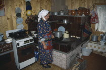 Hutsul woman in kitchen.