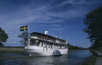 The SS Diana cruise boat with Swedish flag flying from upper deck.