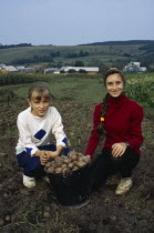 Girls helping with potato harvest.