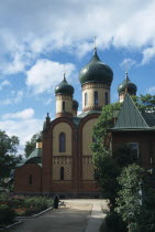 Russian Orthodox Convent.  Exterior facade with onion dome rooftops and gardens.