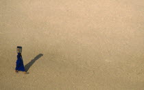 Water carrier in desert near the pyramids.