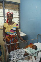 Woman and her baby in a ward of the local hospital