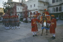 The City Palace complex.  Shambhu Niwas Palace  present residence of the Maharana or Rajput clan head.  Courtyard with parade of private guards and horses.