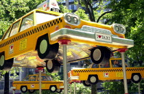 Madison Square Park and Flat Iron Building. Taxi cab sculptures