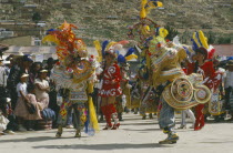 La Diablada Carnival procession and spectators.