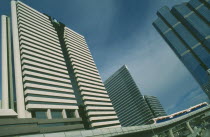 The Skytrain and highrise buildings in the commercial district around Silom Road.