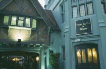 Hotel Du Vin frontage lit up in evening light.