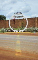 Uganda, Equator, North and South sign. Line across the road.